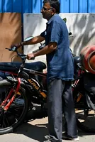 Indians forced ‘back in time’ to cooking with coal as Iran war gas shortages lead to long fuel queues 