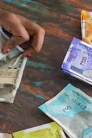 Rupee sinks to new low as soaring Brent nears $110