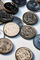 Rupee recovers from lowest level, gains 9 paise to 91.90 against US dollar