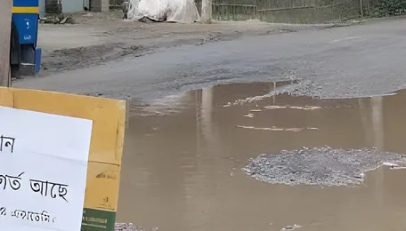 Large potholes turn Lalmonirhat-Burimari highway risky 