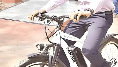 NTR collector rides electric bicycle to promote fuel conservation 