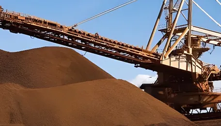 Dalian iron ore little changed, faces steel production curbs in China hub