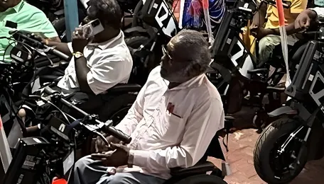 Fifty persons with disabilities receive wheelchairs that double as electric vehicles 