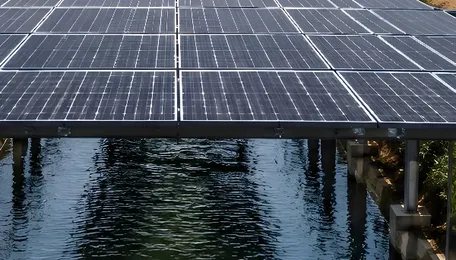 While countries lose water in the heat and dispute land for energy, India places solar panels over irrigation canals to generate electricity, shade the water, and transform agricultural infrastructure into a clean power plant. 
