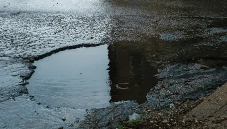 Tambaram Camp Road Potholes Persist After Utility Work; Road Restoration Promised