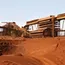 Iron ore ticks up, but posts weekly loss on tariff woes