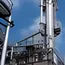 Prices edge down on higher wind, LNG supply